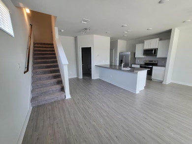 Kitchen featuring stainless steel appliances, whi