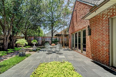 This outdoor seating area is the perfect spot for enjoying a cup of coffee in the mornings or a glass of wine with friends at night.