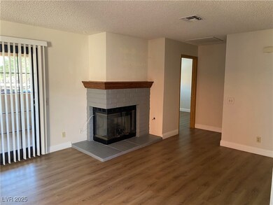 Unfurnished living room with a textured ceiling, w