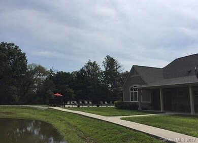 Clubhouse with pool beside the pond