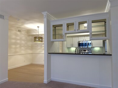 The kitchen offers a pass-through/breakfast bar an