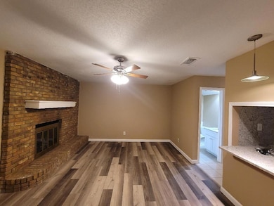 Unfurnished living room with wood finished floors,
