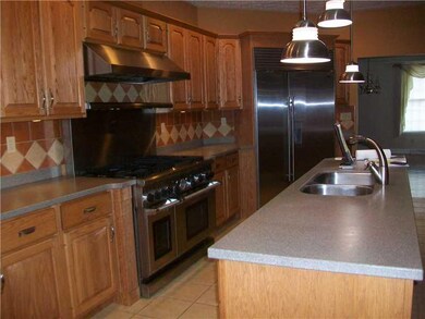 Kitchen. Corian countertops, custom-made cabinetry