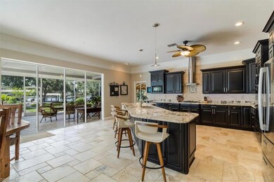 Open kitchen allows for easy access to pool area a
