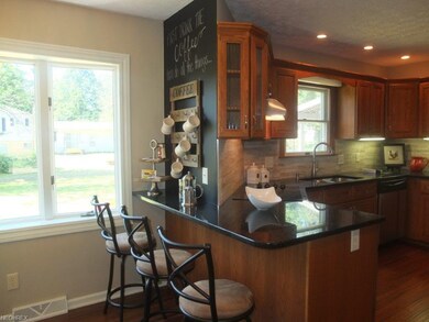 Kitchen has a beautiful breakfast bar.