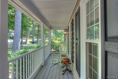 A full front porch lends the perfect place to rock your cares away