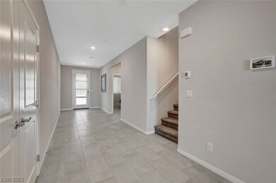 Entry with office/bedroom 5 and stairs to second l