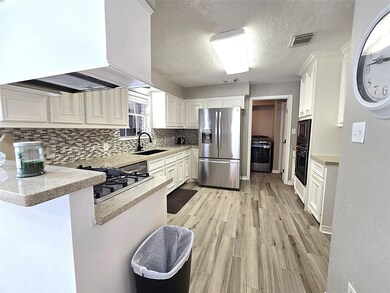 Elegant kitchen with sleek countertops, modern sta