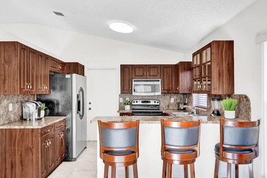 Kitchen with Stainless appliances and break/snack