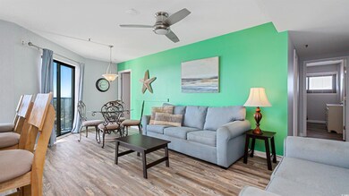 Living room featuring light wood finished floors, healthy amount of natural light, and ceiling fan