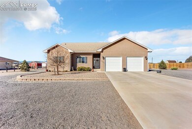 Ranch-style home featuring stucco siding, an attac