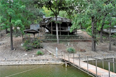 Lakeside of home offers nice tiered yard with care