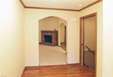 Entry way with HW floors and access to basement an