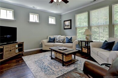 Natural light pours in through the various windows in the great room.