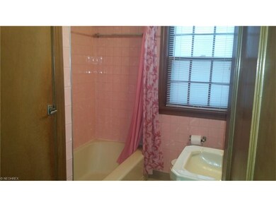 first floor full bath room with tub and shower