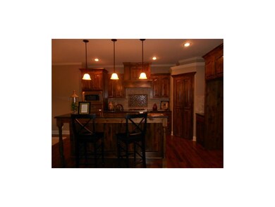 Granite Kitchen with gorgeous custom cabinets.