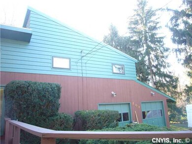 Exterior Front. Roof angle and double garage doors