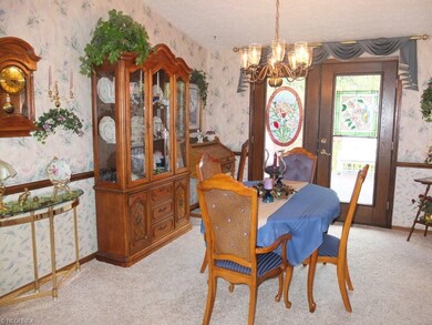 Dining room with vaulted ceiling.