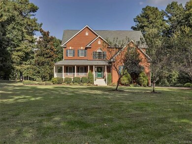 The expansive front yard is sheltered from the roa