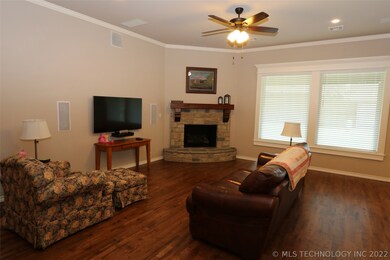 Lovely stone fireplace with gas logs and gas start
