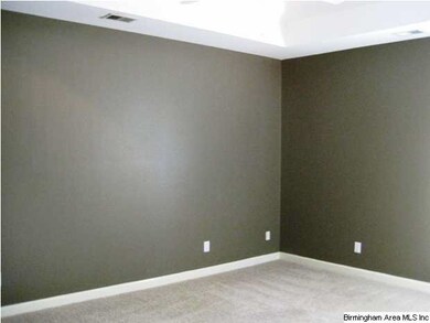 Large master with a tray ceiling and fan. Walk in 