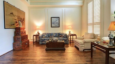 Formal living area to the left as you enter the home. Plantation shutters look out on the front of the home. Vaulted ceiling with recessed lights. Your furniture will only be enhanced by these beautiful handscraped floors.