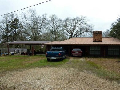 Exterior Back. Covered parking