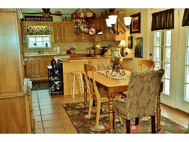 Dining Room. Double French doors offer added beautiful views while dining.
