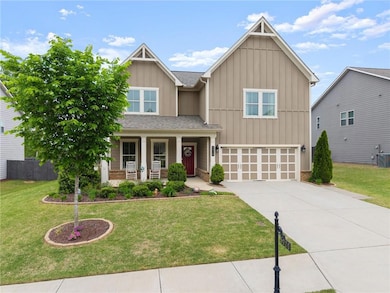 Craftsman inspired home with an attached garage, a