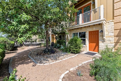 View of yard featuring a balcony