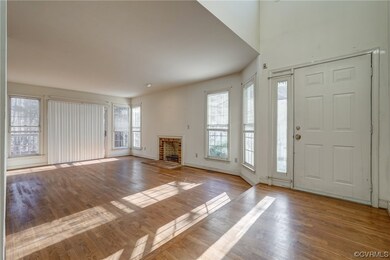 Living room with fireplace and hardwood floors