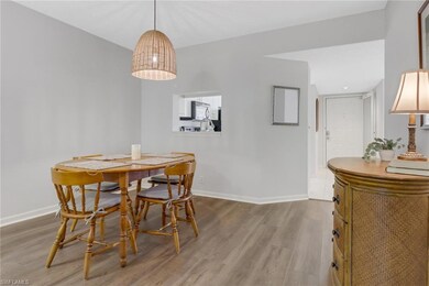 Kitchen featuring white cabinets, light tile patte