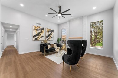 Living area with wood finished floors, baseboards,