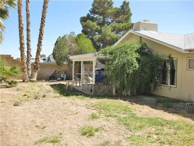 Yard/Garden. Large backyard with a covered patio j