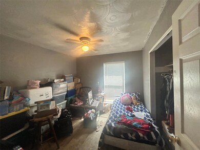Bedroom with a closet, ceiling fan, and hardwood /