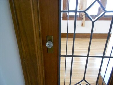 Other. Natural wood door with leaded glass and gla