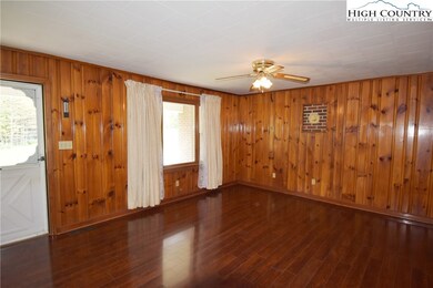 The living room has real pine paneling, and new la