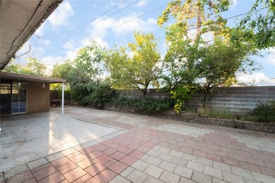 Fenced backyard with a patio