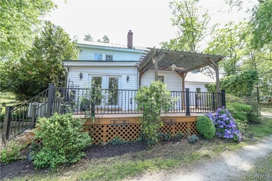 Rear deck and pergola with beautiful landscaping