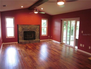 FAMILY ROOM W/ VAULTED CEILING & WOOD BURNING FIRE