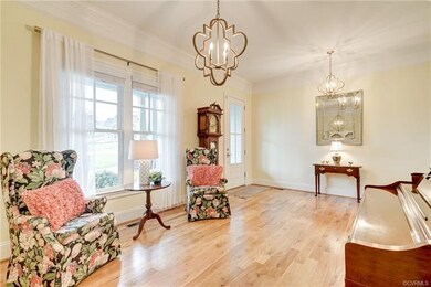 The Foyer is open to the sun-filled Living Room. G