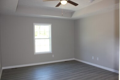 Primary Bedroom w/Trey Ceiling and Walk-in Closet