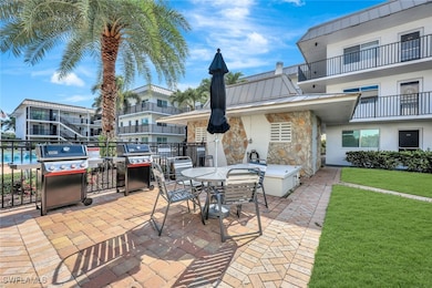 View of patio featuring area for grilling and outdoor dining area