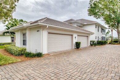 Expansive detached 2-car garage with paver driveway.