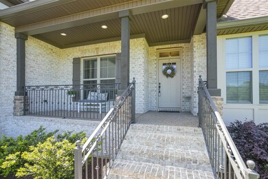 The covered porch is made for relaxing on warm spr
