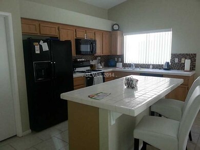 Property Photo. Kitchen with Breakfast Bar and Rev