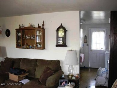 Living room looking into kitchen