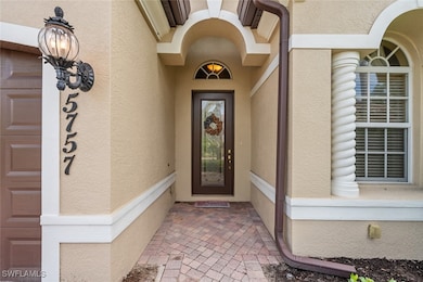 Entrance to property with stucco siding
