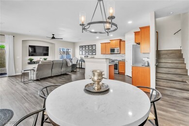 Dining space featuring ceiling fan with notable ch