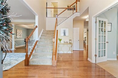 Grand foyer with cathedral height ceilings
